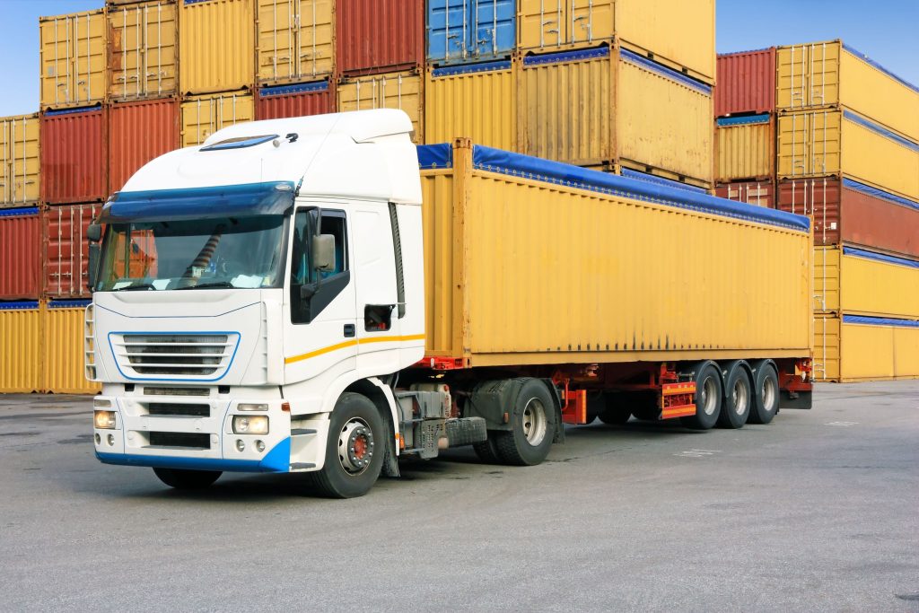 United Freight Solutions trucks running an interstate lane