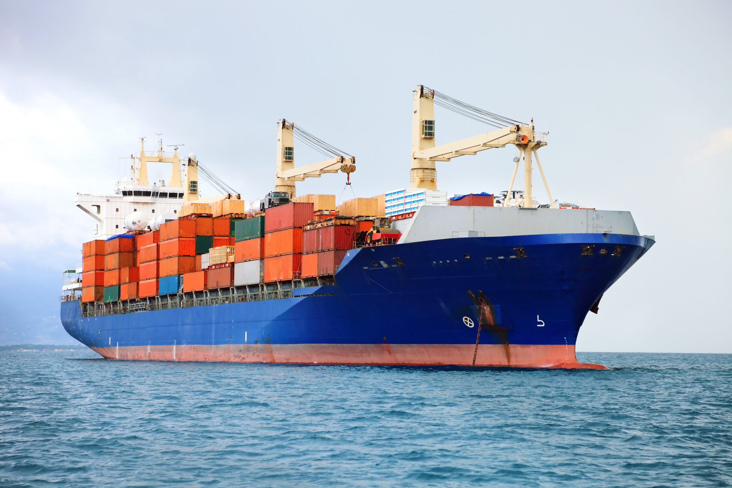 Container ship being unloaded by gantry cranes at a US port