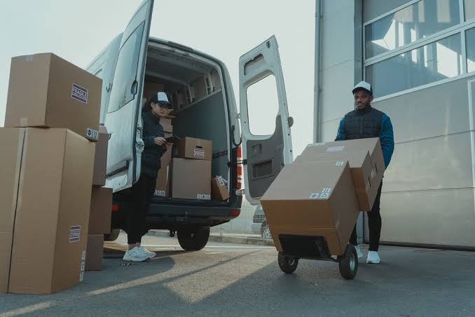 Box truck making a final-mile delivery on a city street